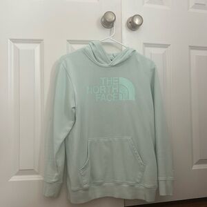 Girls’ The North Face Hoodie in light teal, size XL.